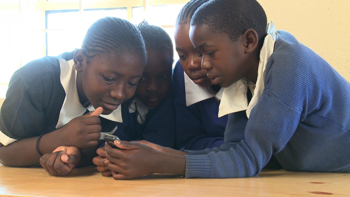 Kenyan students play mobile game. Photo: Ed Owles, Worldview Kenyan students play mobile game. Photo: Ed Owles, Worldview